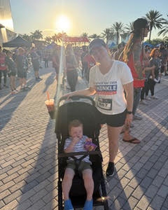 Katie at a community 5K with her children.